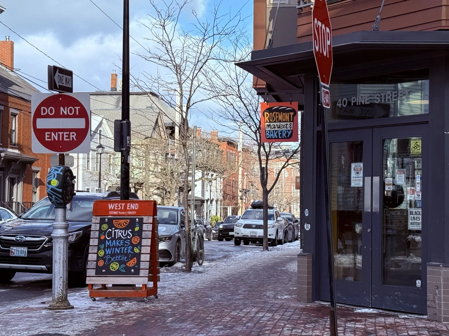 Snowy West End street corner outside Rosemont Market on Pine Street, Portland Maine